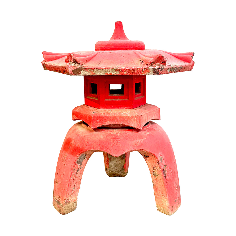 Red ceramic pagoda on a white background